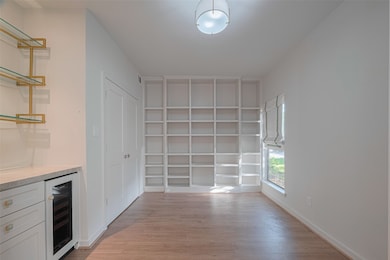 This area could be a bedroom with closet or study