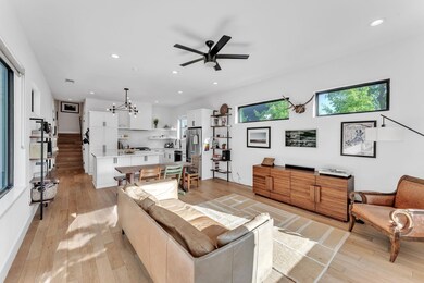 Living room with recessed lighting, visible vents