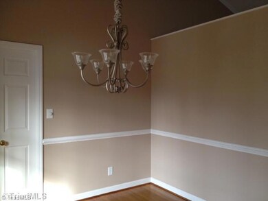 Dining Room. Dining Room just inside the entry...has vaulted ceiling and is open to the Great Room.