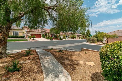 View of asphalt street with a residential view, street lights, and sidewalks