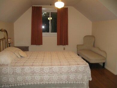 One of the two SECOND FLR. bedrooms (two more on f