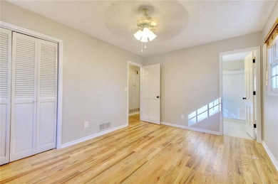 Unfurnished bedroom featuring ensuite bath, ceilin