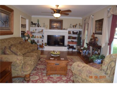 Wood burning fireplace- shiny hardwood floors- bui