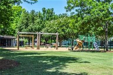 Walking trails and a playground provide a great op
