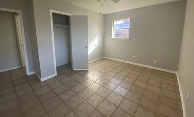 Unfurnished bedroom with ceiling fan, a closet, a 