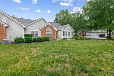 Single story home featuring a front lawn, brick si