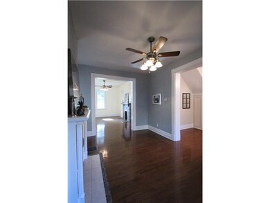 Living Room. Gleaming wood floors throughout foyer
