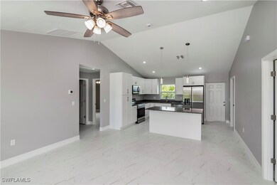 Kitchen featuring dark countertops, marble finish