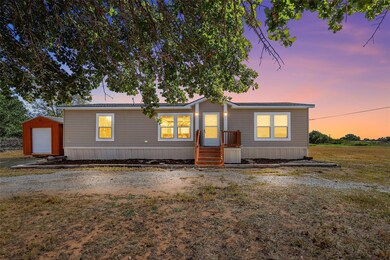 Manufactured / mobile home featuring a storage she