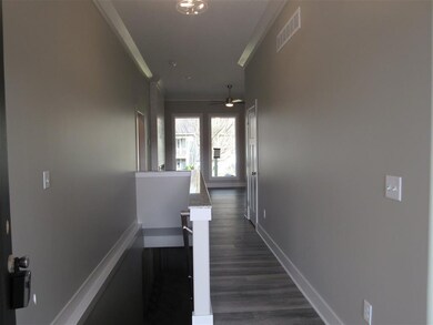 Entry with granite on stairwell to basement.