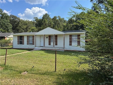 Ranch-style home with brick siding and covered porch