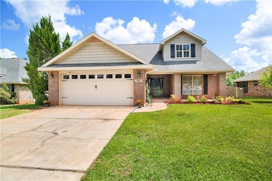 View of front of property featuring brick siding, a front yard, a garage, driveway, and roof with shingles
