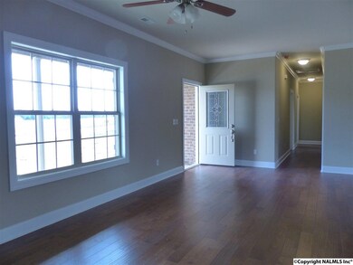 Enter into the Family Room that flows into the Dining Room and into the Kitchen.