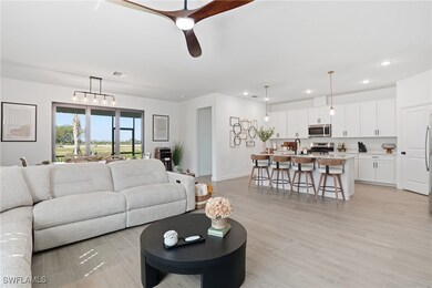 Living room featuring recessed lighting, light wood-style floors, and ceiling fan