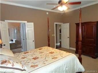 THE MAIN BEDROOM FEATURES VOLUME CEILINGS AND CROW