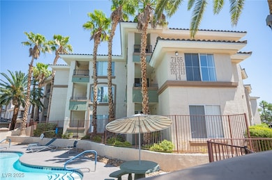 View of property with a community pool