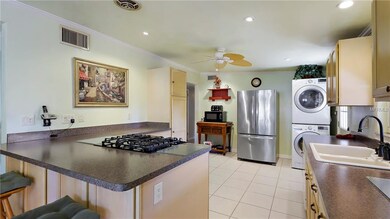 Beautiful stainless steel refrigerator and range.