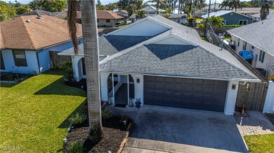 View of front of property featuring a garage and a