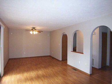 Living Room. Decorative arches add to the ambiance