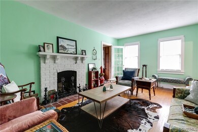 The Formal Living Room is the perfect space to sit around the fireplace & entertain guests!