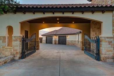 Gated Driveway Leads to Oversized 4 Car Garage