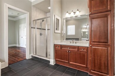 Primary bath with walk in shower, two sinks.