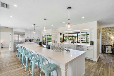 Chefs kitchen with oversized island.