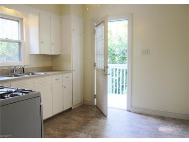 Leads to back yard and garage.