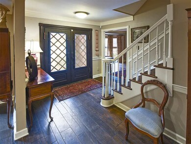 Custom Tuscan Doors grace every entry to this larg