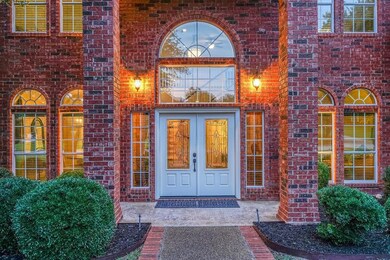 Grand entry with two story covered porch and foyer