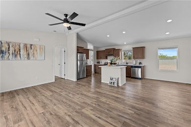 View of great room/kitchen/dining area from front door