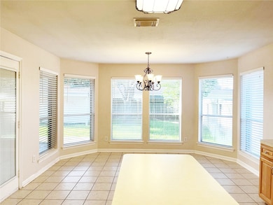 Bright and inviting breakfast room with abundant n