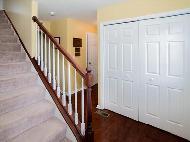 Hardwood flooring through the entry and kitchen.  