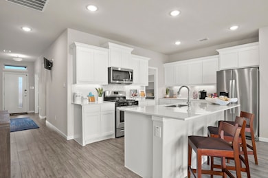 Kitchen in the Masters home plan by Trophy Signature Homes – REPRESENTATIVE PHOTO