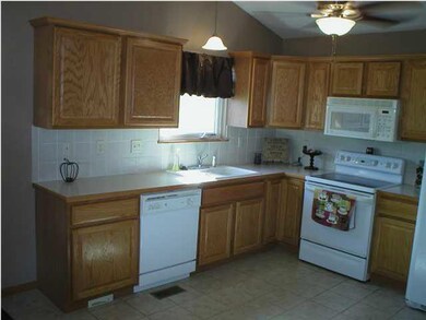 Kitchen. Tile floor and notice electric dust pan u