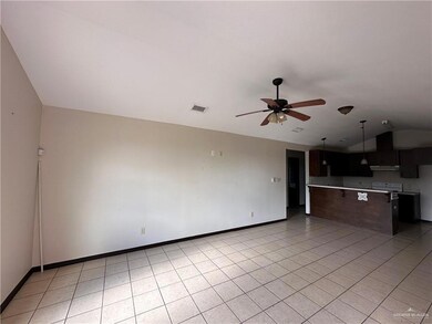 Unfurnished living room with light tile patterned flooring and ceiling fan