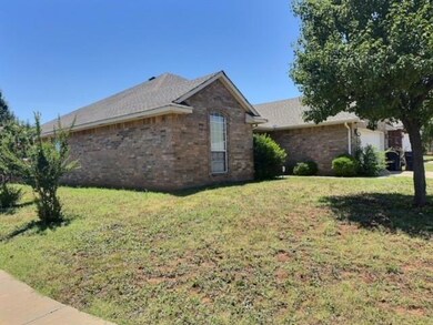 View of side of property with a yard