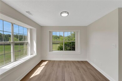 Empty room featuring wood finished floors and baseboards