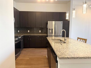 Kitchen featuring a sink, tasteful backsplash, a 