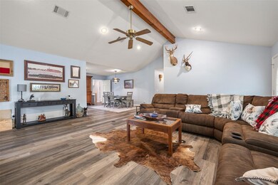 Living area featuring wood finished floors, ceili
