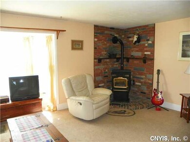 Living Room. The pellet stove helps keep fuel bill