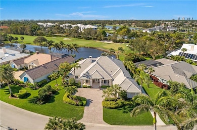 Aerial view with golf course and water view
