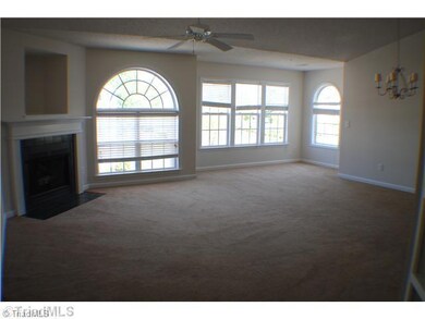 Dining Room. Extended Dining area. Living room w/ fireplace and TV niche.