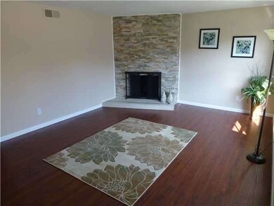 Living Room with lovely stacked stone fireplace su
