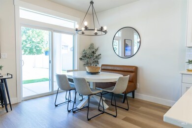 Dining room with a chandelier and light wood-type flooring