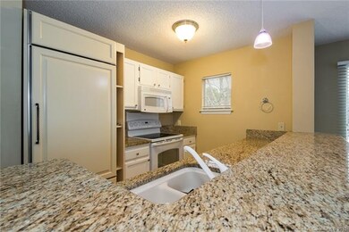 Kitchen with Sub Zero Fridge and Granite Counter Tops