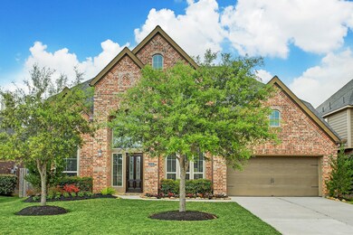 Luscious landscaping with double driveway and beautiful brick elevation.