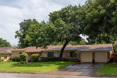 Two car garage with access to the utility room and