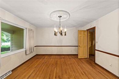 Formal dining room with hardwood floors and large 
