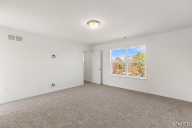 Empty room featuring carpet